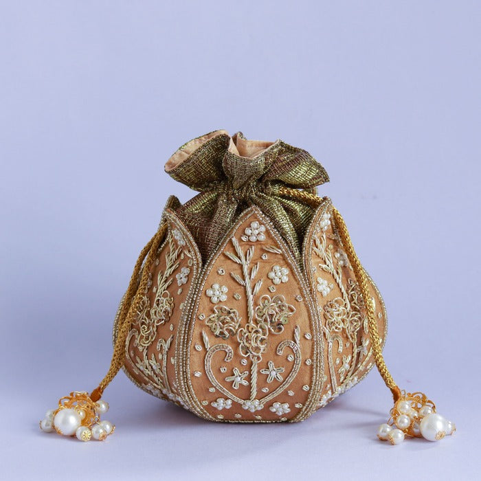 Pushp Zardozi embroidered mini lotus potli bag by The Tan Clan with intricate gold embroidery and drawstring closure.