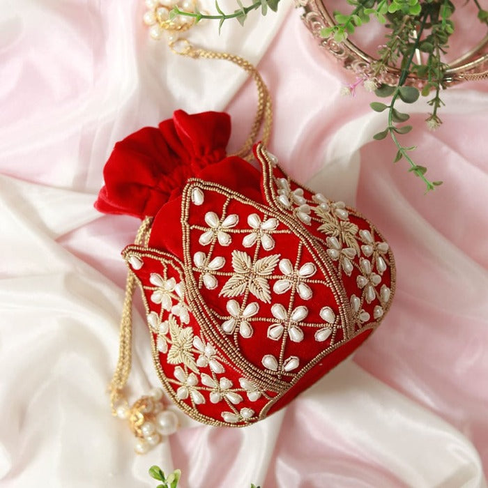 Pushya hand-embroidered mini lotus potli bag by The Tan Clan with intricate embroidery and traditional design.