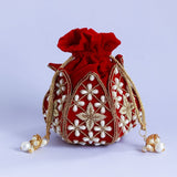 Hand-embroidered Pushya mini lotus potli bag by The Tan Clan with intricate embroidery and compact design for traditional occasions.