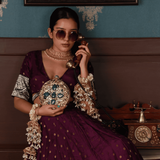 Qurbat embellished brass clutch by The Tan Clan featuring intricate metalwork and elegant design for special occasions.