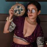Qurbat embellished brass clutch bag with intricate designs, crafted by The Tan Clan, featuring a decorative, elegant accessory for special occasions.