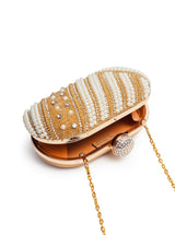 Golden hand-embroidered pearl clutch bag by Rabia, featuring intricate embroidery and elegant design from The Tan Clan.