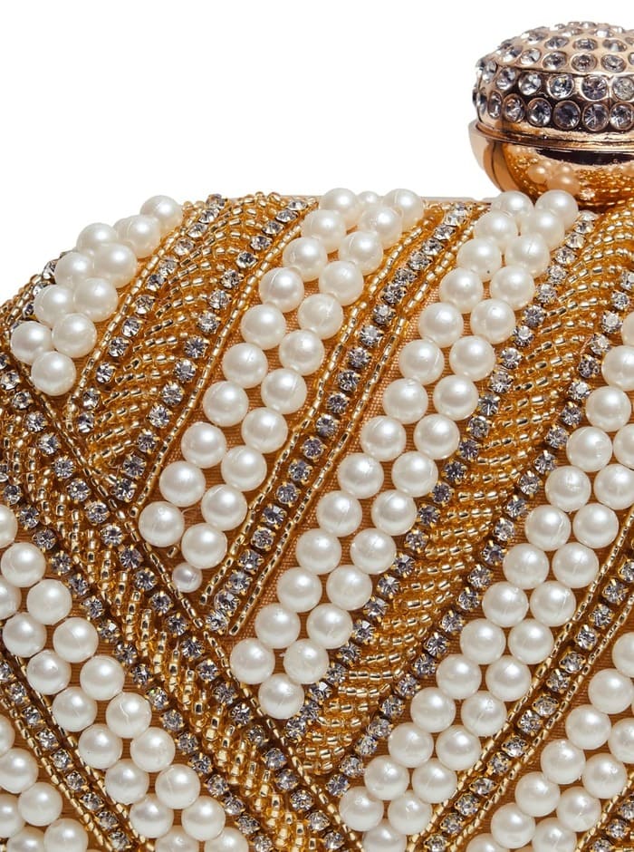 Golden hand-embroidered pearl clutch bag by The Tan Clan with intricate embroidery and elegant design.