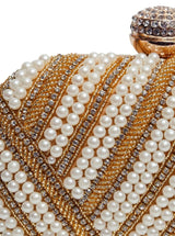 Golden hand-embroidered pearl clutch bag by The Tan Clan with intricate embroidery and elegant design.