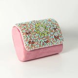 Rainbow embellished flap-over clutch bag by The Tan Clan with colorful rainbow details and a sleek, stylish design.