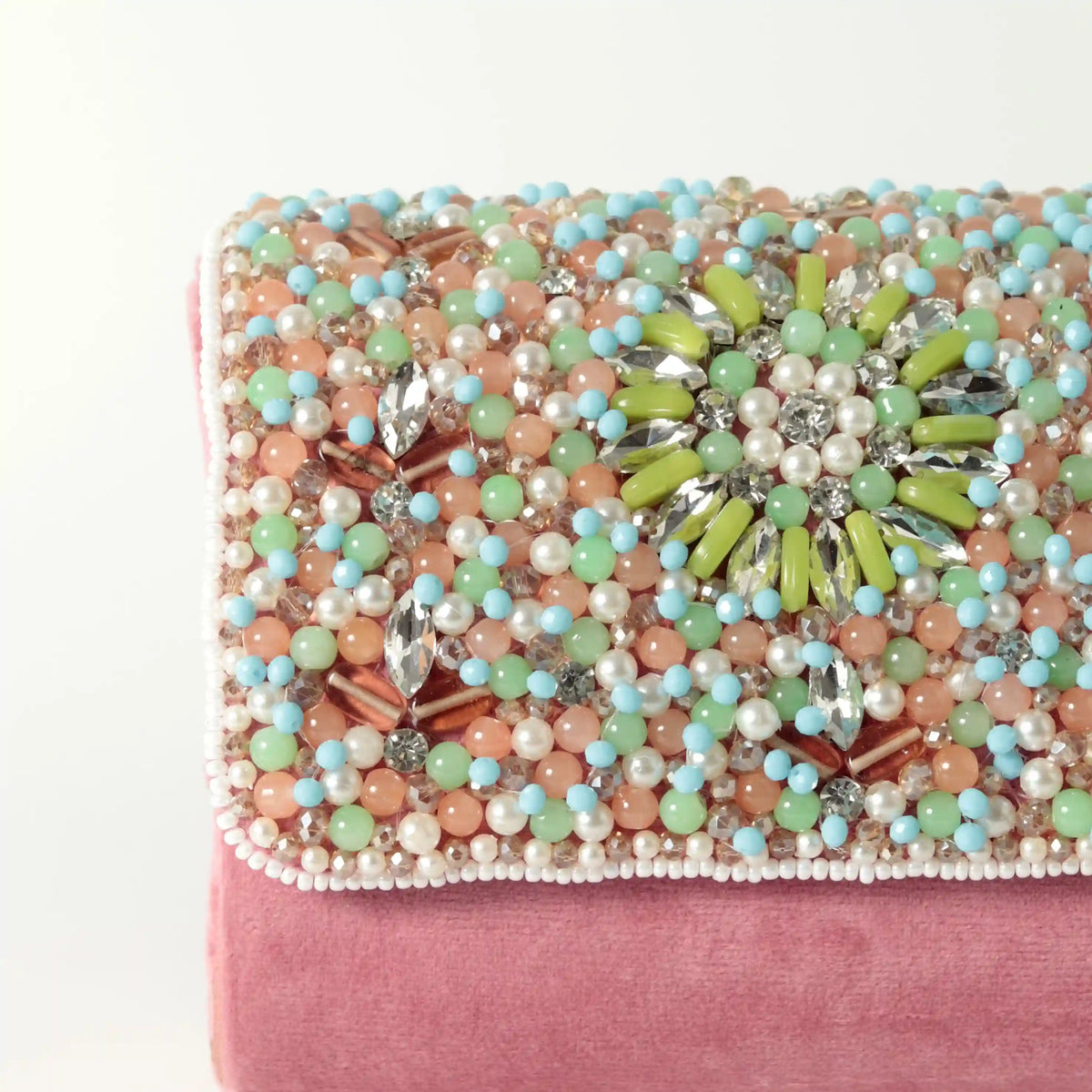Rainbow embellished flap-over clutch bag by The Tan Clan, featuring colorful rhinestones and a sleek design.