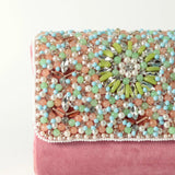 Rainbow embellished flap-over clutch bag by The Tan Clan, featuring colorful rhinestones and a sleek design.