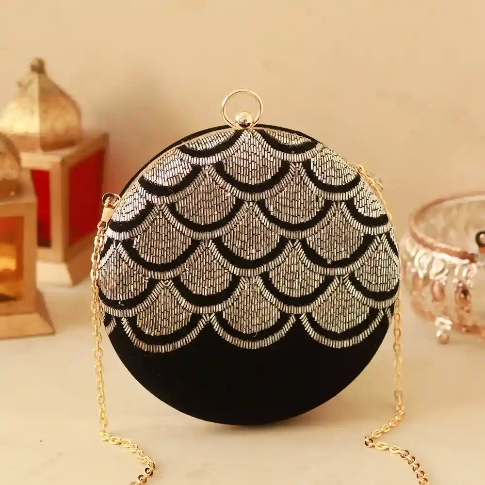 Hand-embroidered Rajwada clutch by The Tan Clan featuring intricate traditional design and elegant craftsmanship.