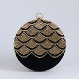 Hand-embroidered Rajwada clutch bag by The Tan Clan featuring intricate traditional embroidery and a sleek design.