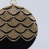 Hand-embroidered Rajwada clutch by The Tan Clan featuring intricate traditional design and vibrant colors.