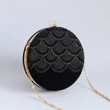 Hand-embroidered Rajwada clutch bag by The Tan Clan featuring intricate designs and a traditional Indian style.