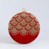 Hand-embroidered Rajwada clutch bag by The Tan Clan with intricate traditional design and elegant craftsmanship.