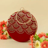 Hand-embroidered Rajwada clutch bag by The Tan Clan featuring intricate traditional embroidery on a rectangular design.