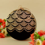 Hand-embroidered Rajwada clutch bag from The Tan Clan with intricate traditional designs and a vibrant, elegant appearance.
