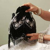 Rangreza Combo featuring Keisha black tassel potli and Sharda silver potli bag with intricate designs, perfect for festive occasions.