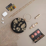 Hand-embroidered Rashida clutch bag by The Tan Clan featuring intricate embroidery and a compact, stylish design for women.