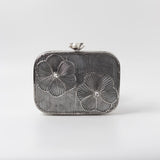 Reema Silver brass wirework clutch by The Tan Clan featuring intricate metal craftsmanship and elegant design.