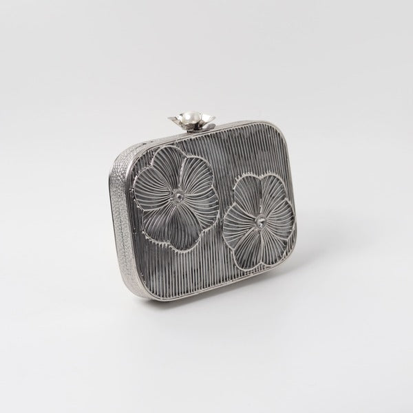 Reema silver brass wirework clutch bag with intricate detailing, stylish accessory by The Tan Clan.