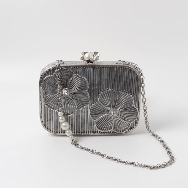 Reema Silver Brass Wirework Clutch by The Tan Clan, featuring intricate silver wire detailing and compact design for elegant occasions.
