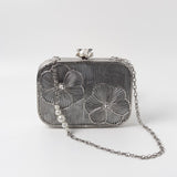 Reema Silver Brass Wirework Clutch by The Tan Clan, featuring intricate silver wire detailing and compact design for elegant occasions.