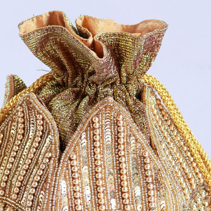 Revati hand-embroidered mini lotus potli bag with intricate embroidery, traditional Indian accessory by The Tan Clan.