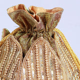 Revati hand-embroidered mini lotus potli bag with intricate embroidery, traditional Indian accessory by The Tan Clan.