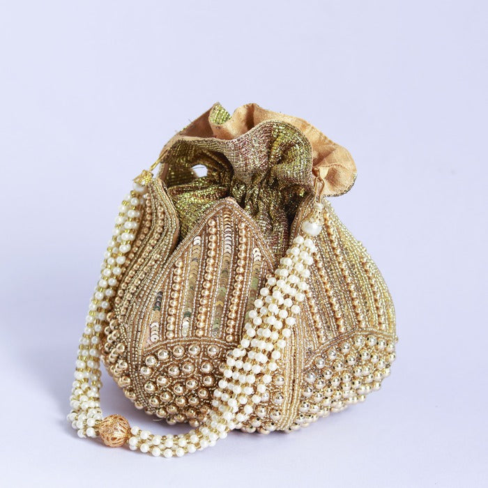 Revati hand-embroidered mini lotus potli bag with intricate embroidery and traditional design, crafted by The Tan Clan.