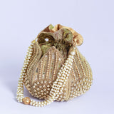 Revati hand-embroidered mini lotus potli bag with intricate embroidery and traditional design, crafted by The Tan Clan.