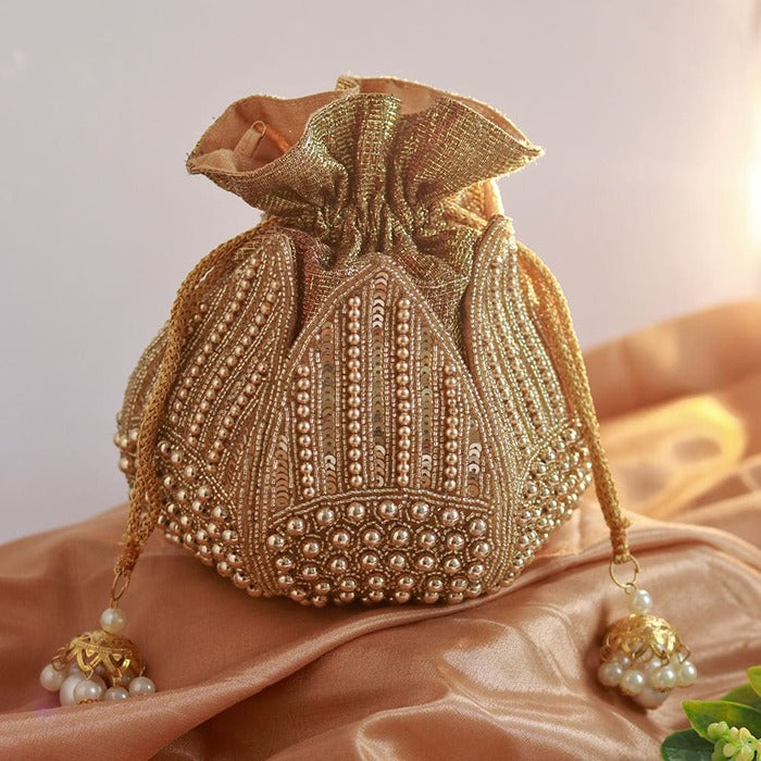 Revati hand-embroidered mini lotus potli bag with intricate embroidery, traditional Indian accessory by The Tan Clan.