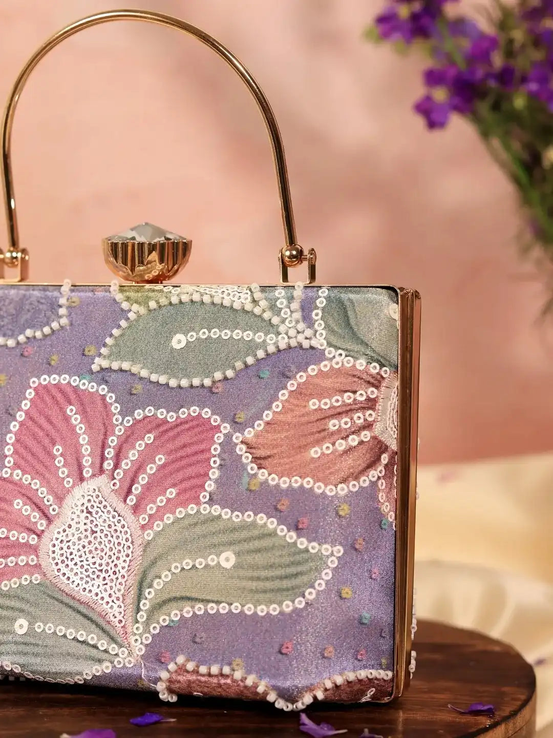 Riveria Multicolor Casket Clutch by The Tan Clan featuring vibrant multicolor design and elegant metal frame.