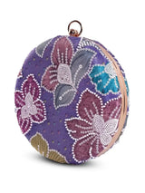 Riveria multicolor round clutch bag by The Tan Clan with vibrant, multicolored pattern and compact, circular design.