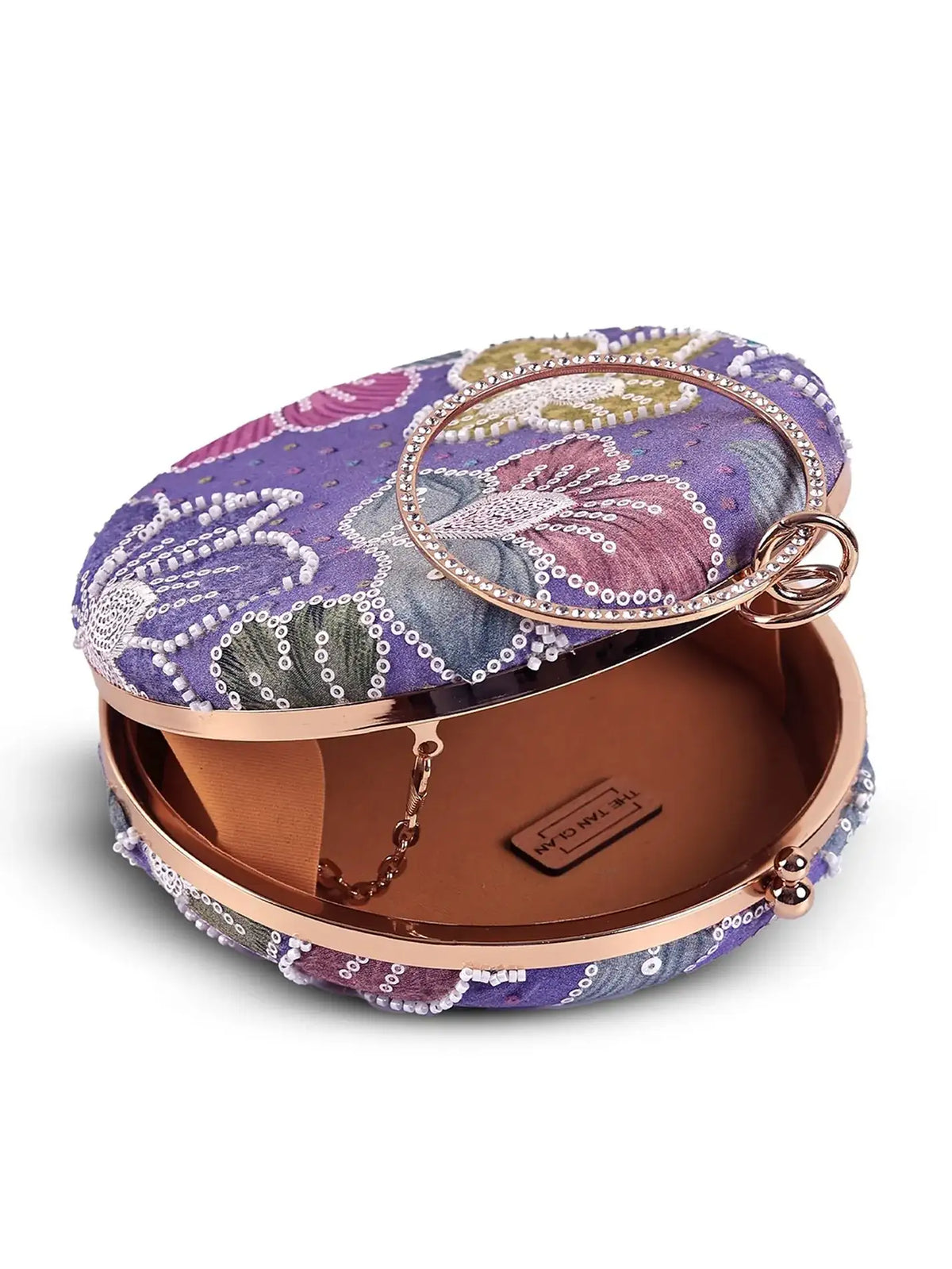 Riveria multicolor round clutch by The Tan Clan, featuring vibrant patterns and a compact design for stylish occasions.