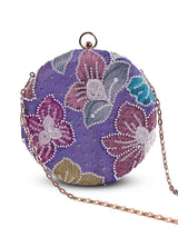 Multicolor round clutch bag by The Tan Clan with a vibrant, multicolored design and compact, circular shape.