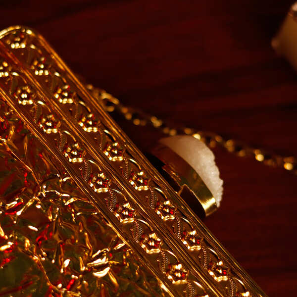 Riwayat Mother of Pearl Clutch by The Tan Clan featuring a sleek design and shimmering mother of pearl exterior.