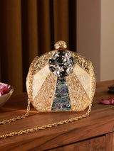 Roma Round Embellished Mother of Pearl Clutch by The Tan Clan, featuring a shiny, round design with decorative pearl accents.