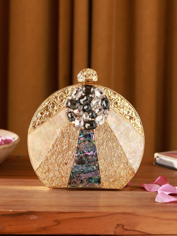 Roma round embellished mother of pearl clutch by The Tan Clan with decorative accents and a smooth, rounded design.