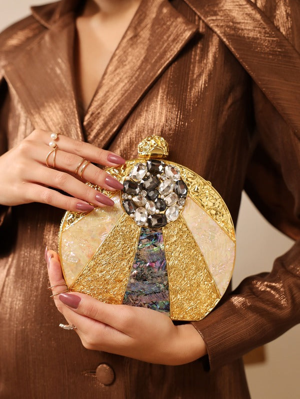 Roma round clutch by The Tan Clan featuring embellished mother of pearl exterior and elegant design.