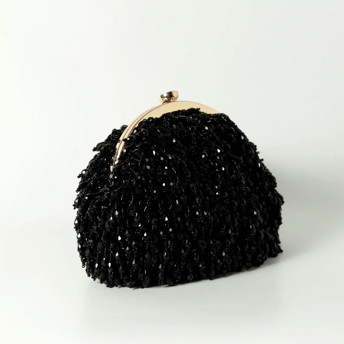 Black Rosa Batua bag by The Tan Clan with a detachable handle, stylish compact leather design for everyday use.