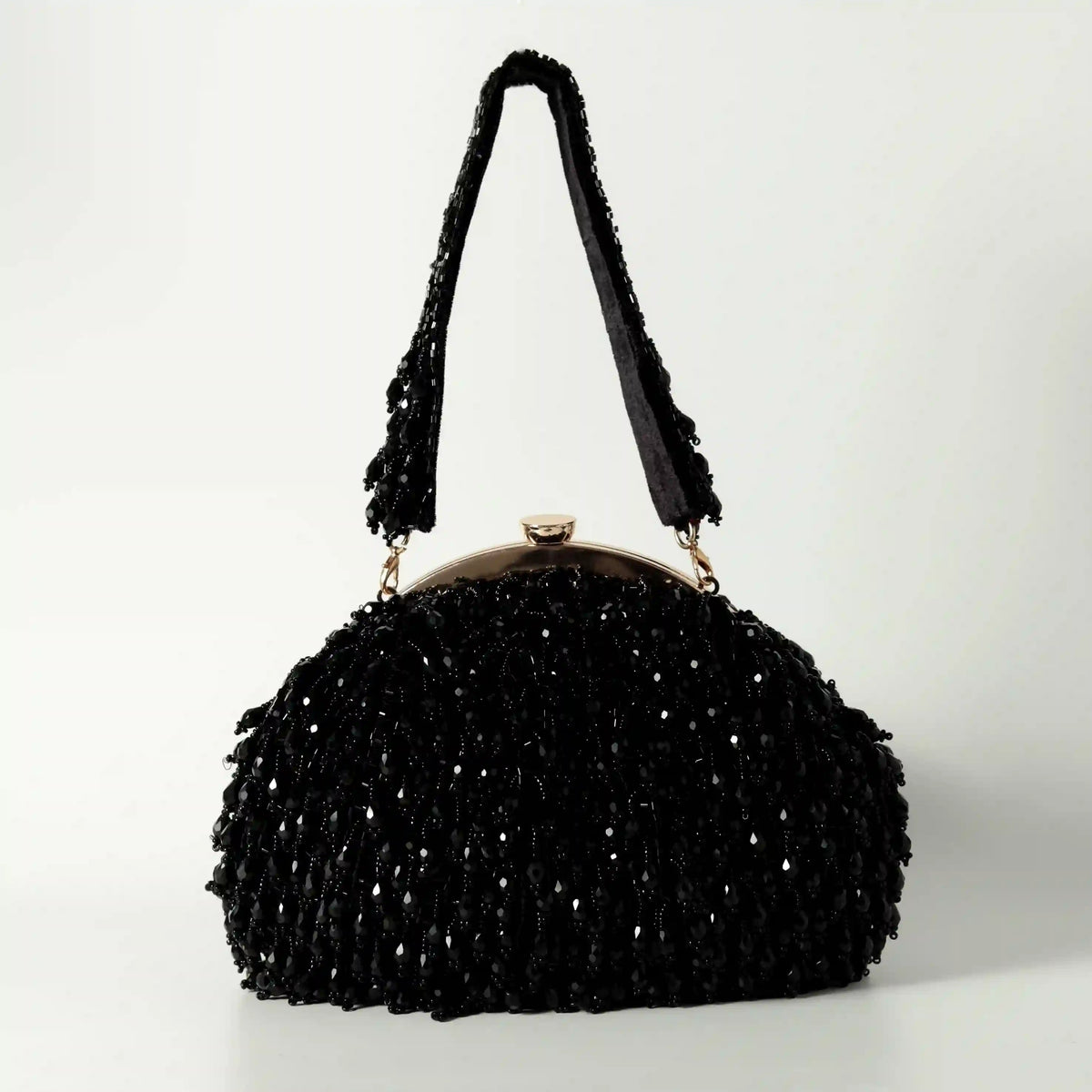 Black Rosa Batua bag with detachable handle from The Tan Clan, showing the stylish, versatile design and textured material.