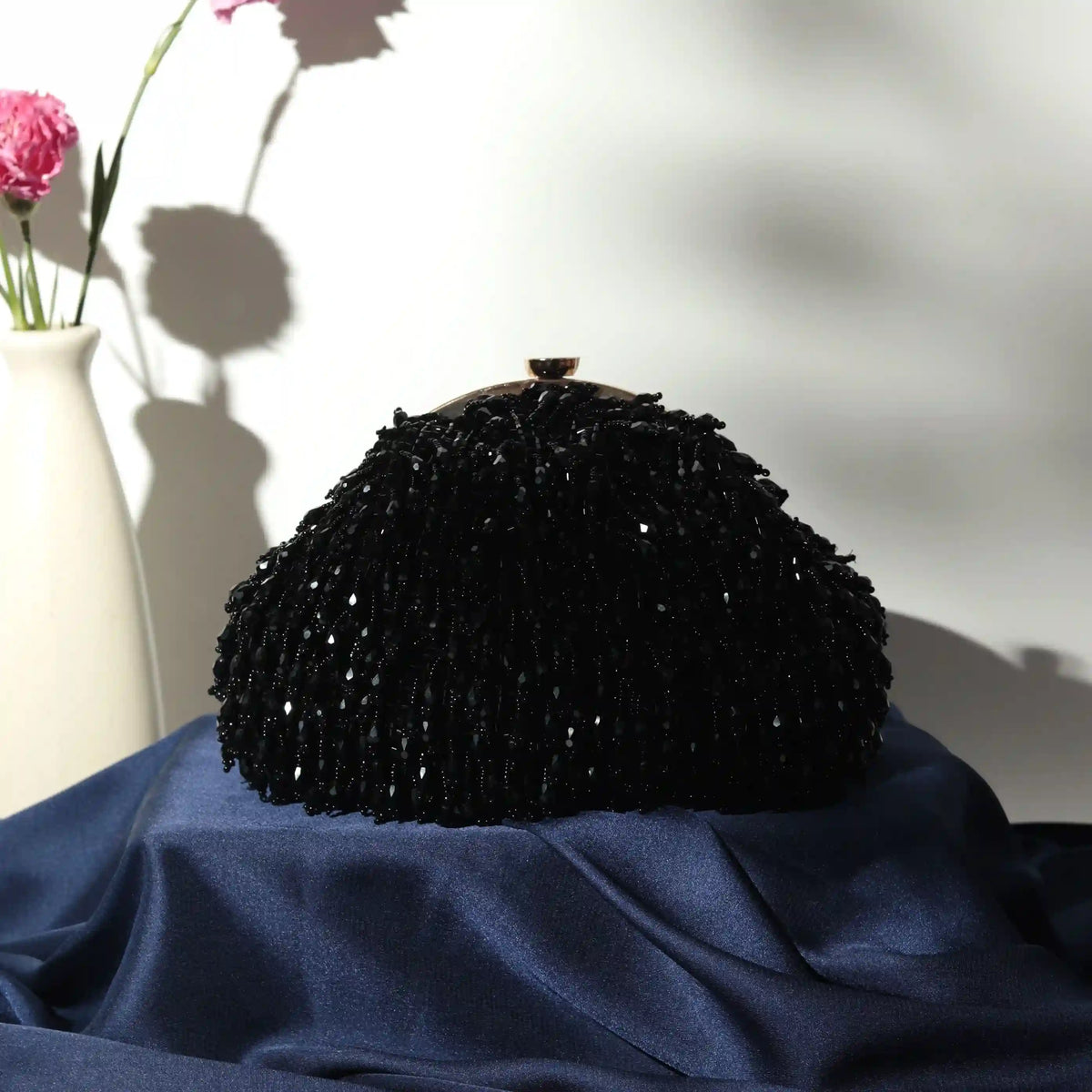 Black Rosa Batua bag by The Tan Clan with a detachable handle, featuring a sleek, stylish design for versatile wear.