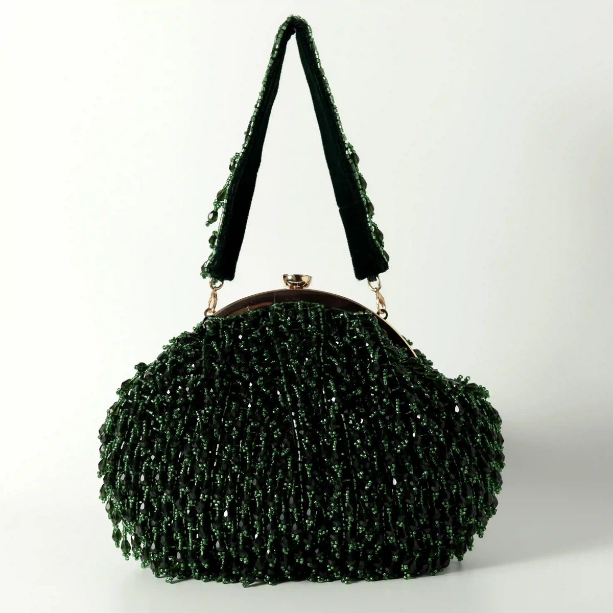 Emerald Rosa Batua Bag with detachable handle by The Tan Clan, showing its stylish design and versatile strap on a neutral background.