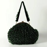 Emerald Rosa Batua Bag with detachable handle by The Tan Clan, showing its stylish design and versatile strap on a neutral background.