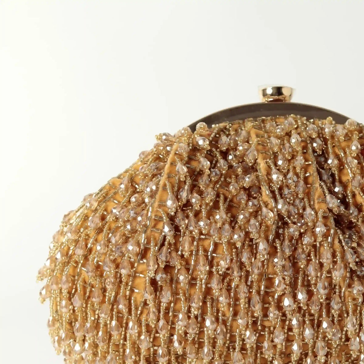 Golden Rosa Batua bag with detachable handle by The Tan Clan, featuring stylish design and versatile carrying options.