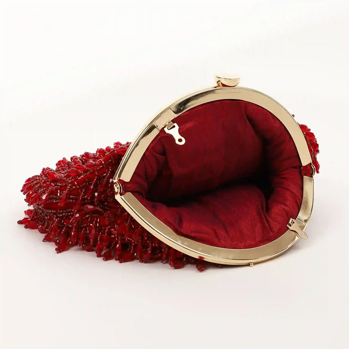 Red Rosa Batua bag by The Tan Clan featuring a detachable handle and stylish design.