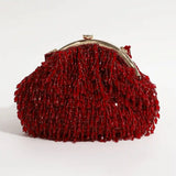 Red Rosa Batua bag with detachable handle by The Tan Clan, showcasing stylish design and versatile carrying options.