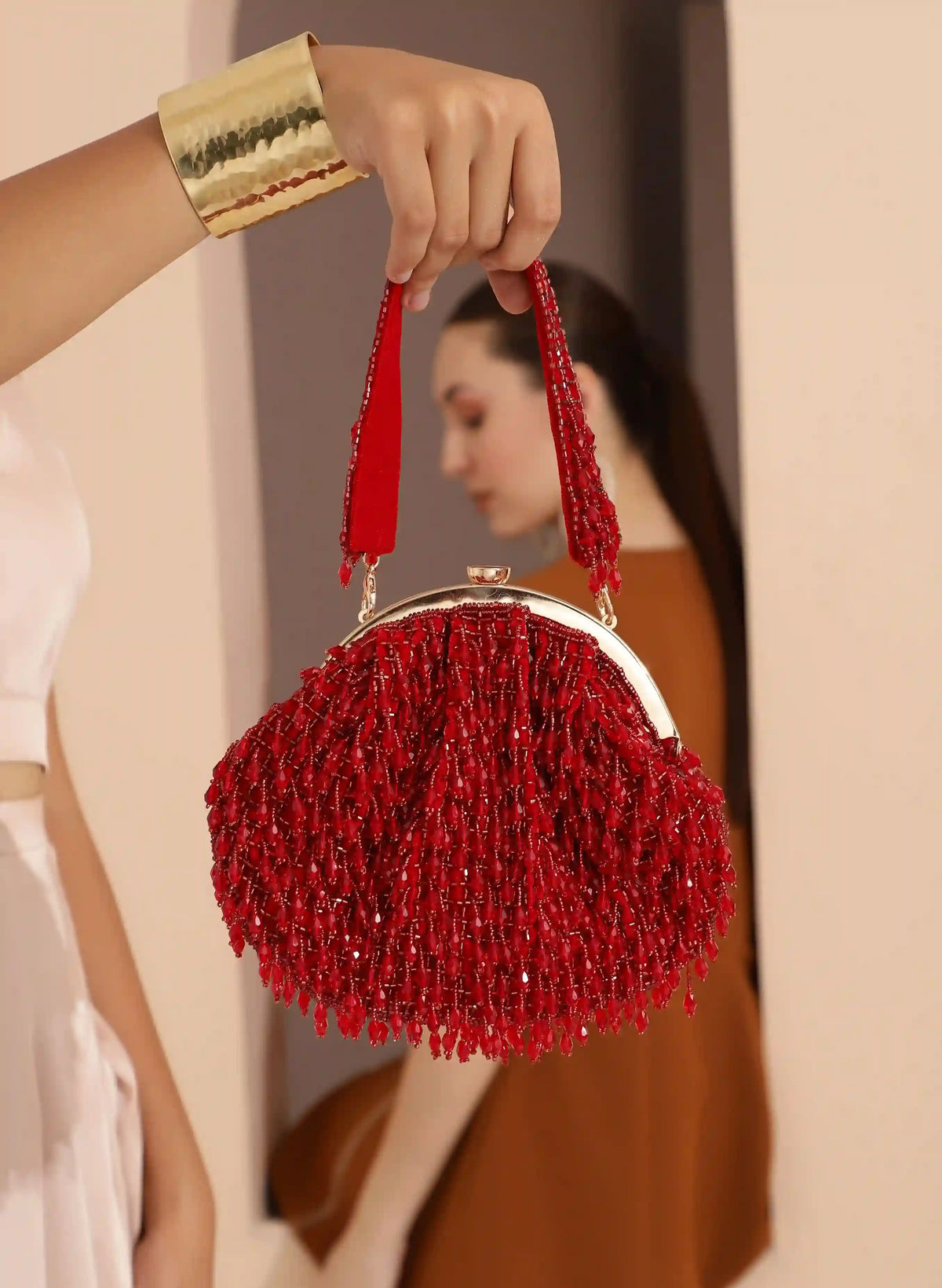 Red Rosa Batua bag by The Tan Clan with detachable handle, showing the stylish, spacious design and vibrant color.