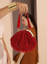Red Rosa Batua bag by The Tan Clan with detachable handle, showing the stylish, spacious design and vibrant color.