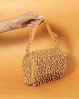 Rosa beaded flap-over clutch bag by The Tan Clan featuring beaded embellishments and a sleek design for elegant occasions.