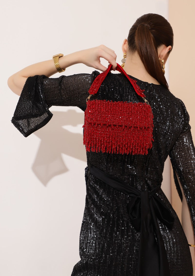 Beaded pink flap-over clutch bag by The Tan Clan with intricate beadwork and a stylish design for elegant occasions.
