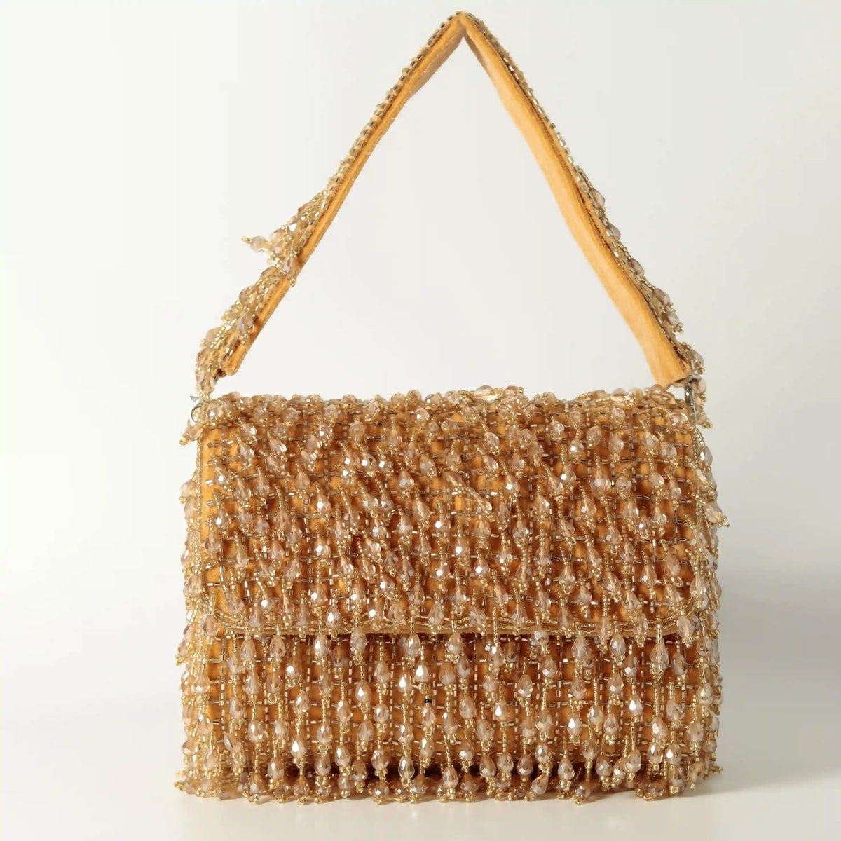 Beaded Rosa Flap Over Clutch Bag by The Tan Clan with intricate beadwork and elegant design.